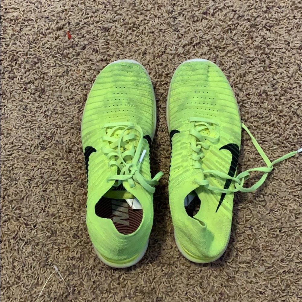 Neon yellow Nike tennis shoes